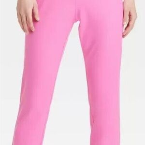 Pink, straight leg cut, mid rise waist.  Faux pockets. Side zipper.